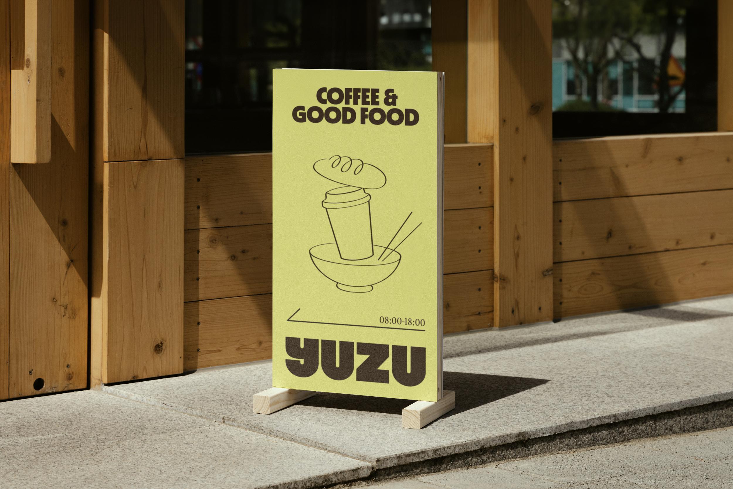 Yuzu Cafe sidewalk A-frame sign outside the shop